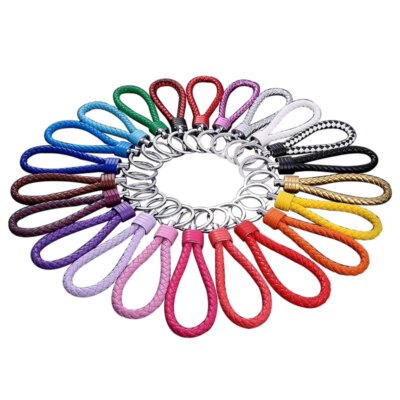 Nouveau porte-clés en corde tressée en acier au tungstène, porte-clés en cuir, pendentif de poupée fait à la main, cadeau de fête, petits bijoux